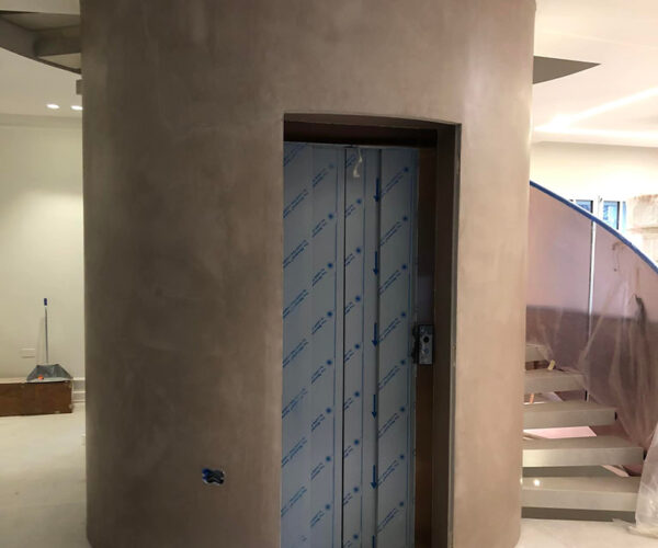 microcemento pareti vano ascensore milano